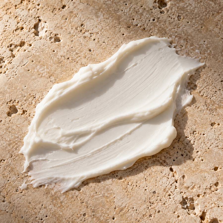 A smear of white cream on a stone slab